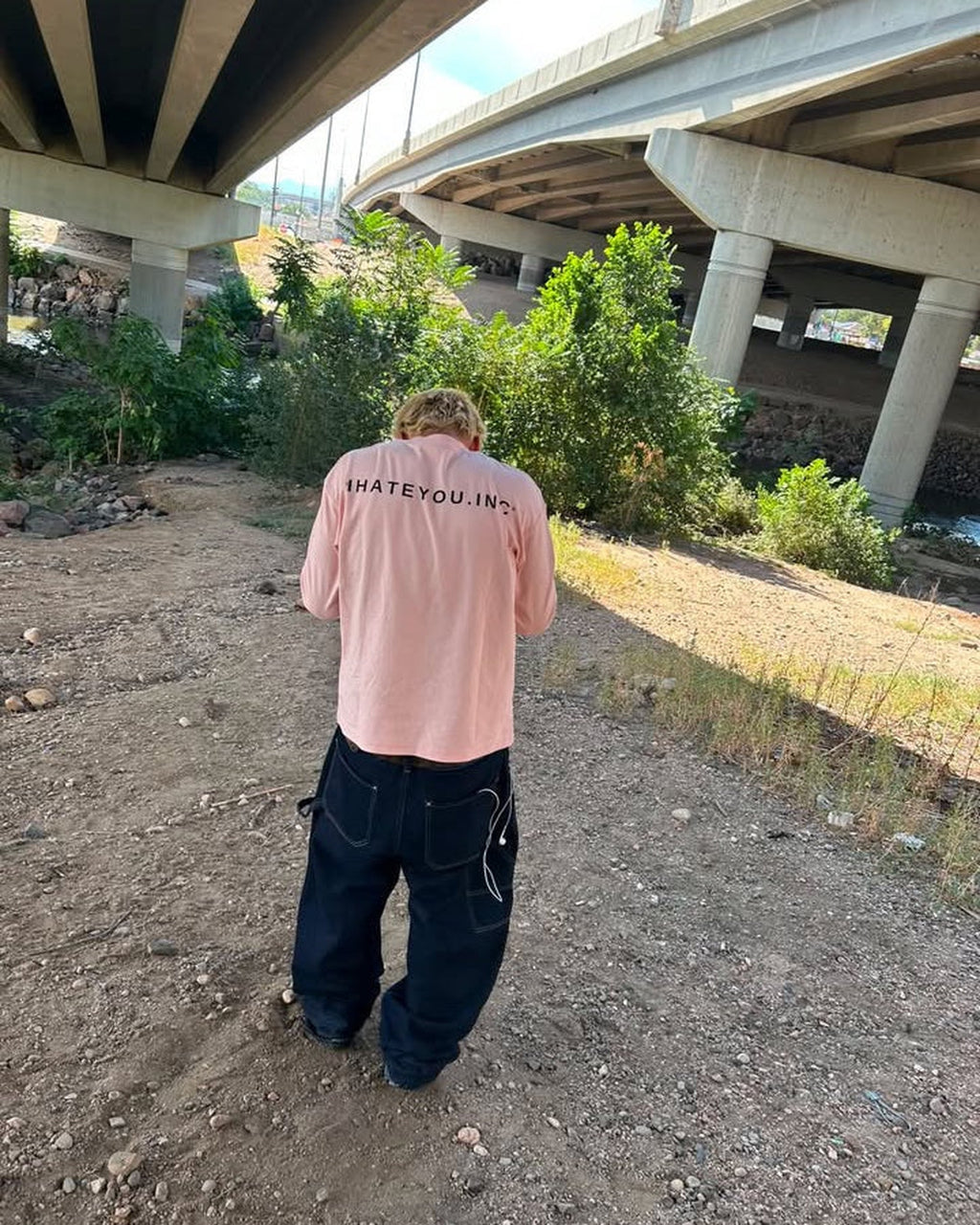 IHATEYOU.inc Light Pink Unisex Crewneck Sweatshirt — front on-model