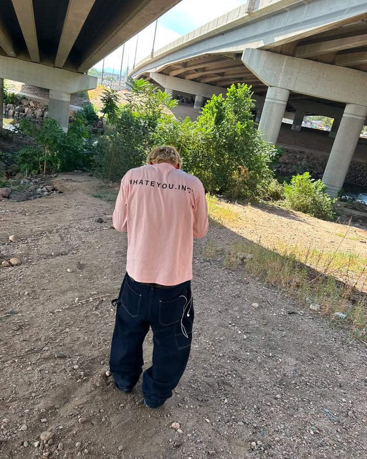 IHATEYOU.inc Light Pink Unisex Crewneck Sweatshirt — front on-model
